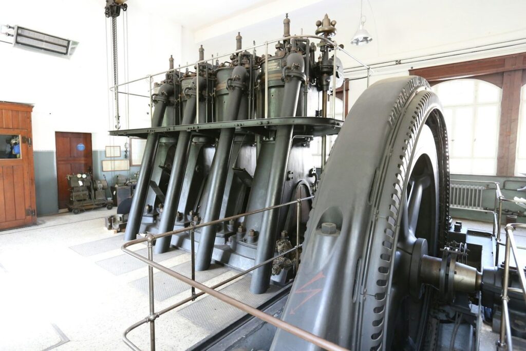 A huge flywheel on a historic diesel engine at the Dieselmuseum in Schramberg, Germany