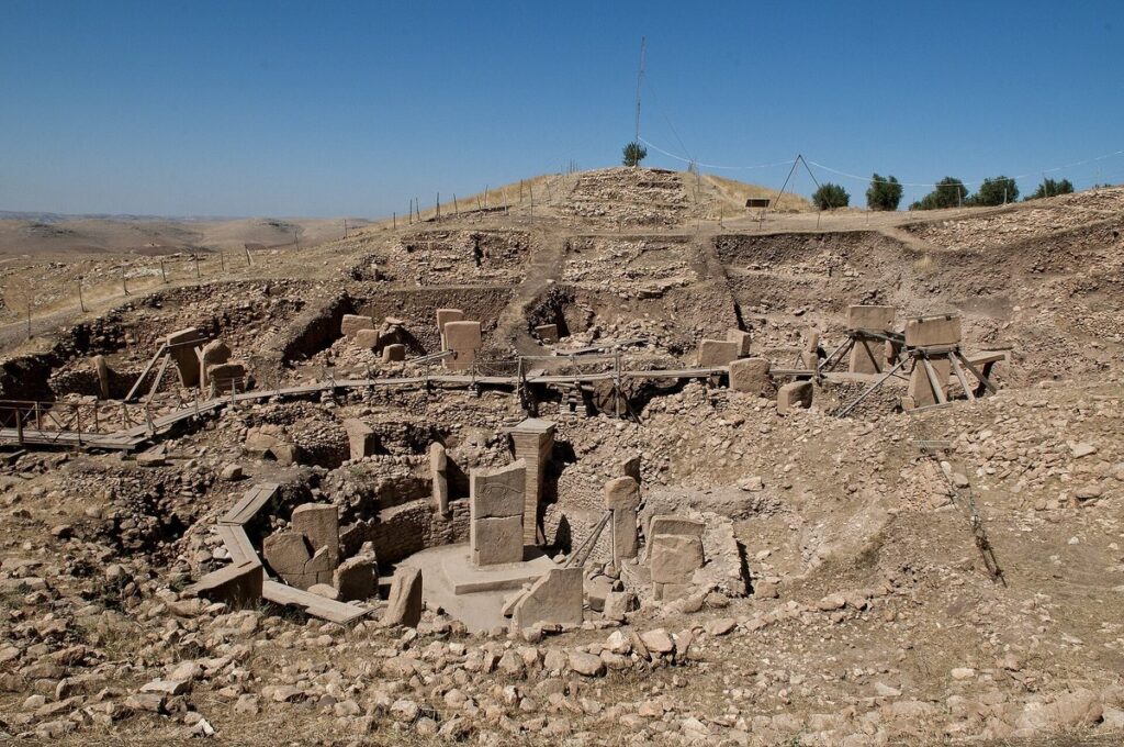 Excavated stone enclosures and T-shaped pillars at the Neolithic site of Göbekli Tepe near Şanlıurfa, Turkey