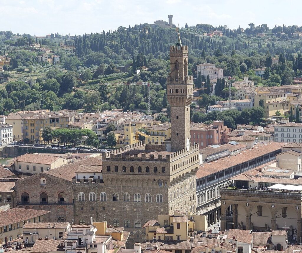 Palazzo Vecchio, Florence's crenellated seat of government, and its tall tower rising above the city rooftops