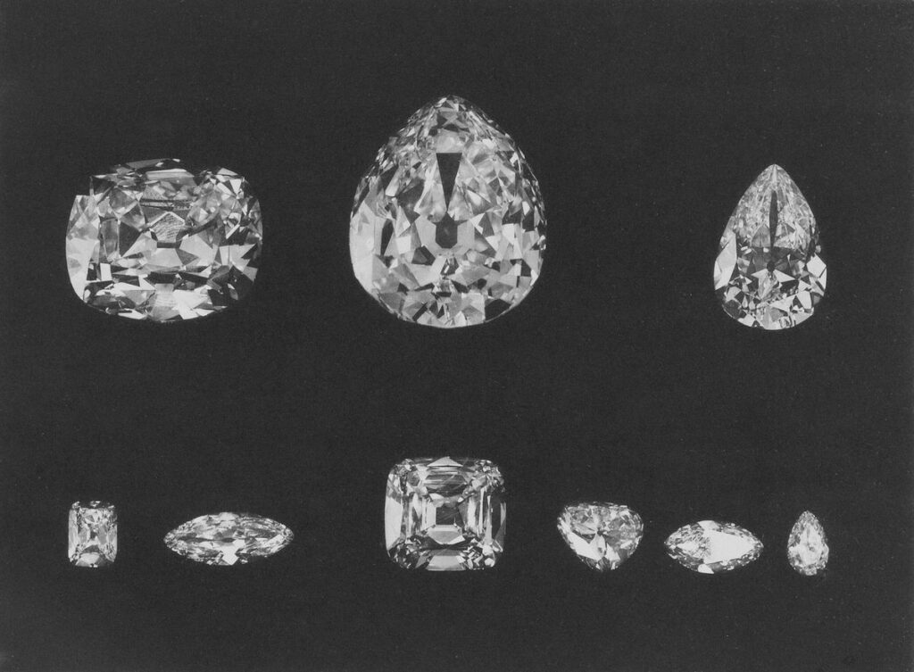 Archival 1908 photograph of the great cut stones of the Cullinan diamond, finished by I.J. Asscher in Amsterdam, laid out on black
